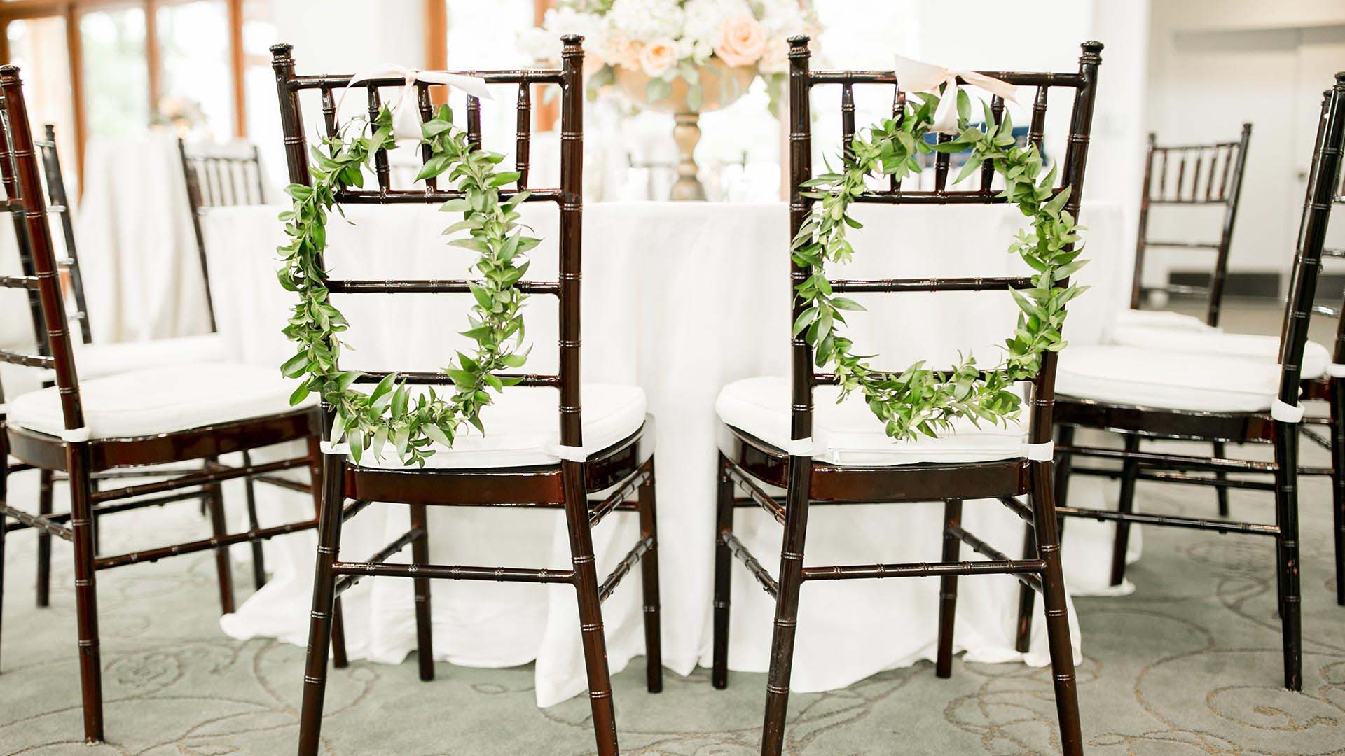 wedding reception decorated chairs